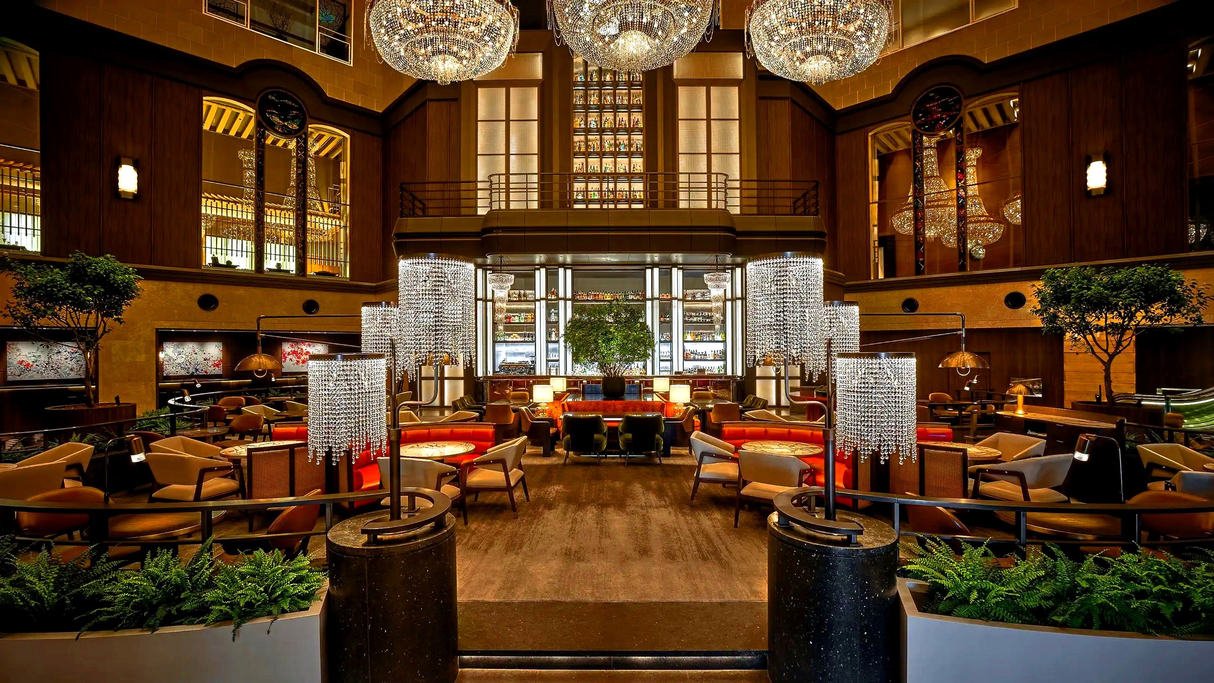 Grand hotel lobby bar with crystal chandeliers and marble columns
