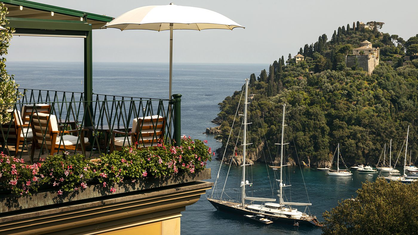 The terrace at Splendido, Portofino, looking down over the harbour and the yachts to Castello Brown on the headland