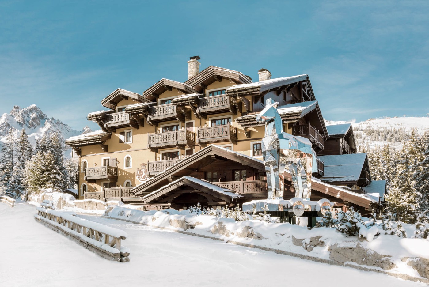 Cheval Blanc Courchevel under snow, Bruno Peinado's mirrored horse standing at the entrance