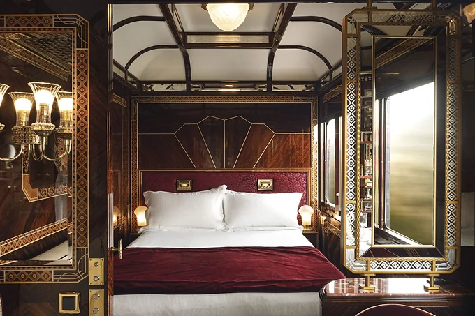 A marquetry-panelled sleeping cabin aboard the Venice Simplon-Orient-Express