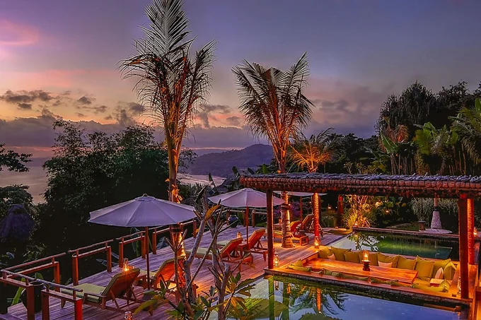 A pool terrace above the jungle at sunset, Nihi Sumba, Indonesia