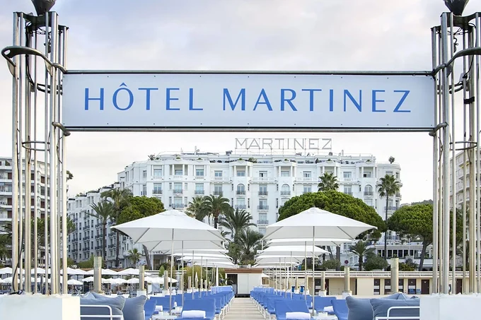The beach entrance sign and facade of Hotel Martinez on the Croisette, Cannes