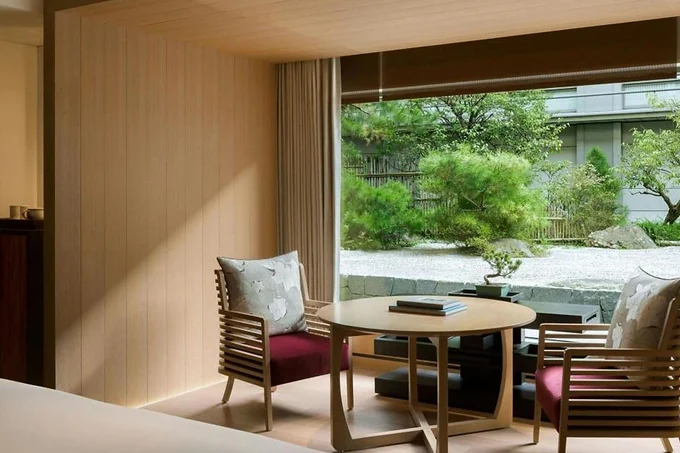 A guest room at The Ritz-Carlton Kyoto opening onto its garden