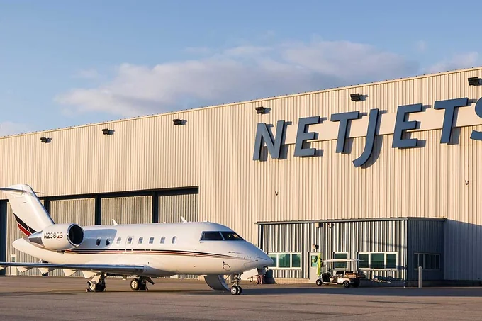 A NetJets aircraft on the apron outside the company hangar