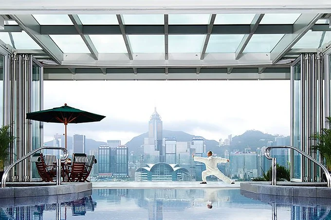 The rooftop pool at The Peninsula Hong Kong above Victoria Harbour