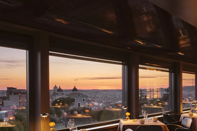 The rooftop restaurant at Hotel Eden, Rome, looking over the city at sunset