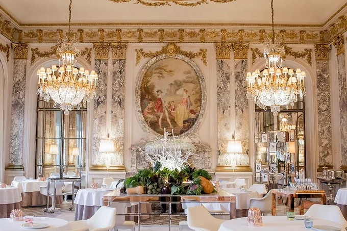 The chandeliered dining room at Le Meurice, Paris