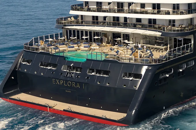 The stern and pool deck of Explora I under way