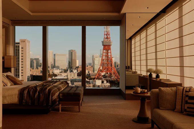 A Tokyo suite at golden hour, looking across the city to Tokyo Tower