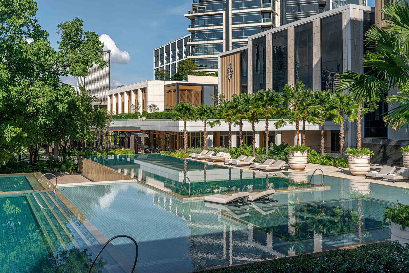 The terraced pools and palms at Four Seasons Bangkok at Chao Phraya River